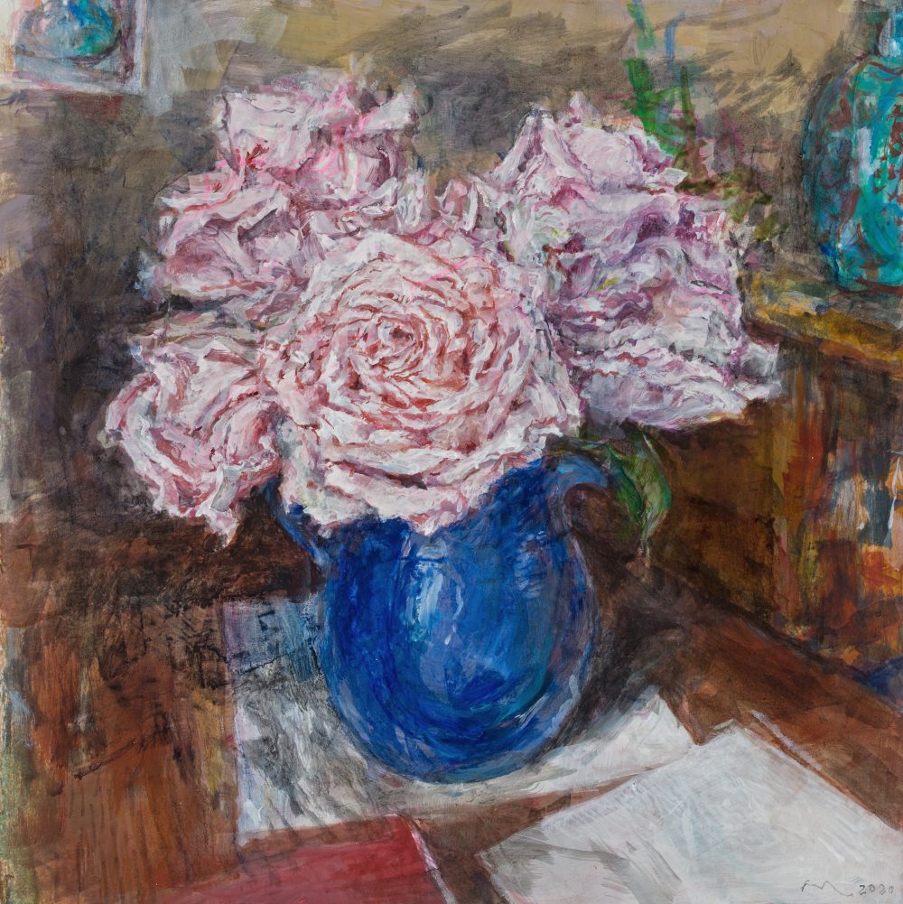 pink flowers in a blue vase
